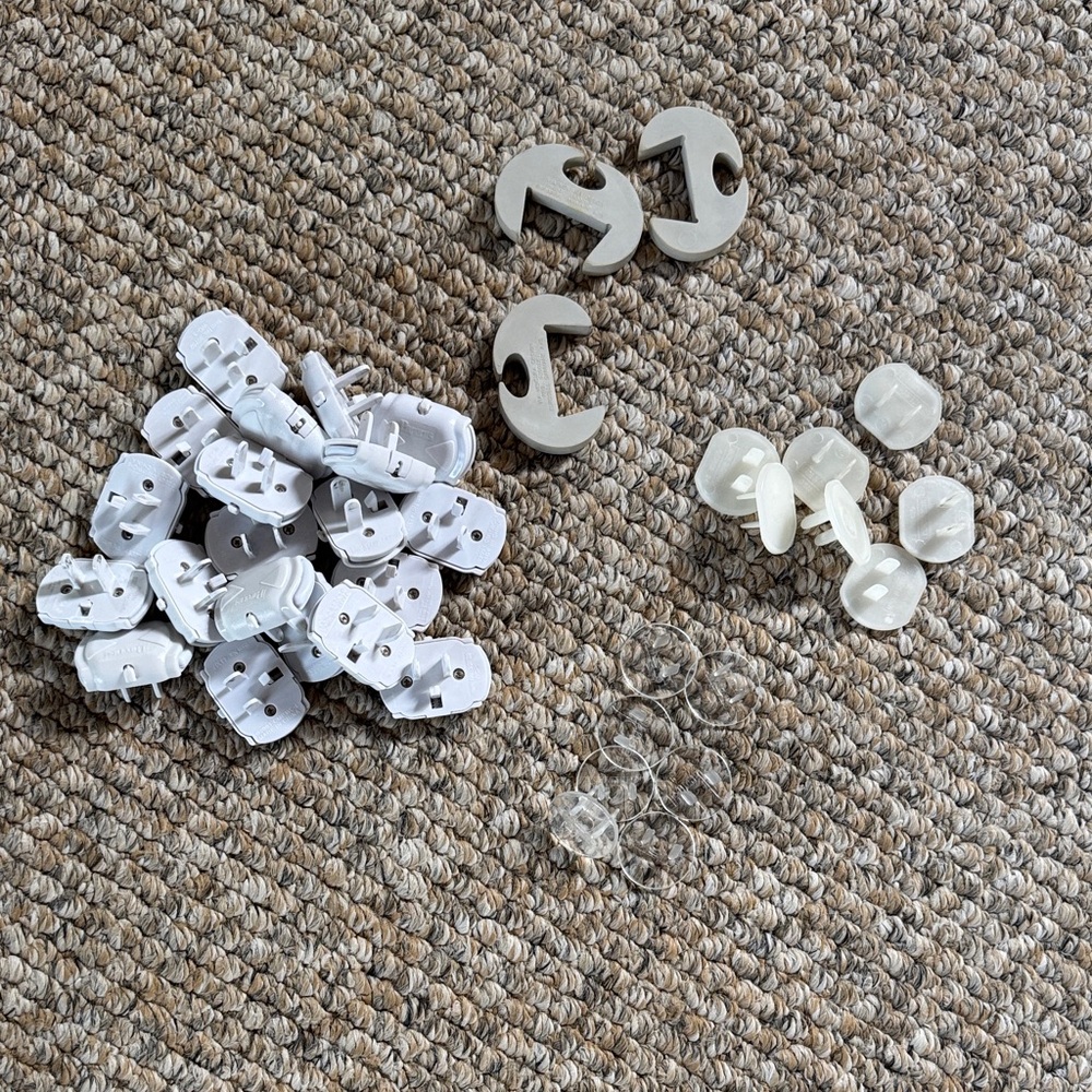 White and Clear Plastic baby proofing outlet covers and finger guards like new